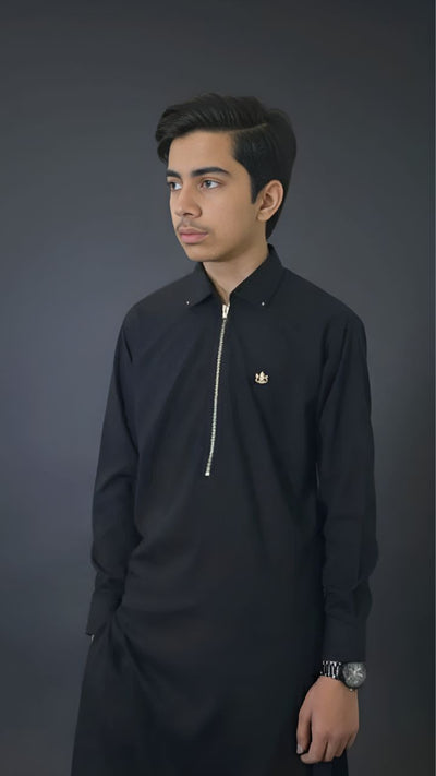 Deep Black kids suit with front zipper, metallic badge, stoppers, and D-bar back design by Asjal Clothes Pakistan.