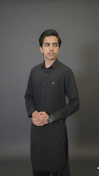 Malesian Black kids kameez shalwar with black logo buttons, front badge, zipper sleeves, and golden collar accent by Asjal Clothes Pakistan.